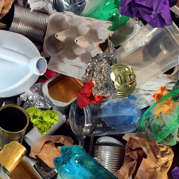 Recycling garbage and reusable waste management as old paper glass metal and plastic household products to be reused as a concept of environmental conservation of material saving energy and money.